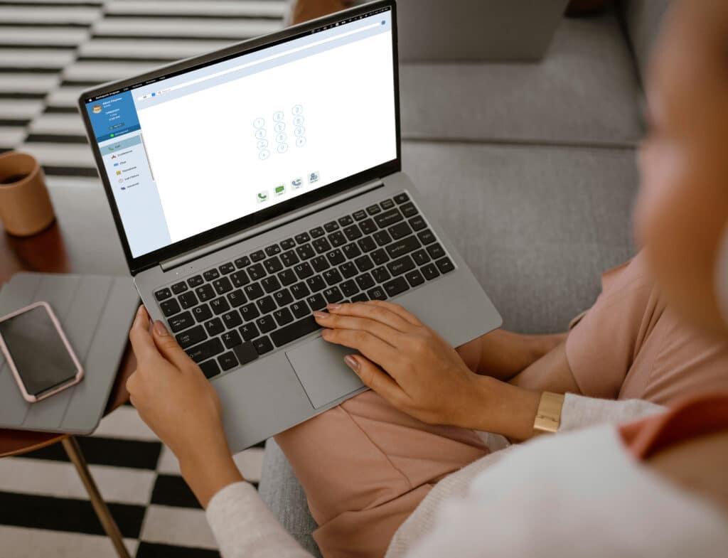A woman using Engage on laptop